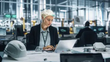 An image of a woman working on her laptop.