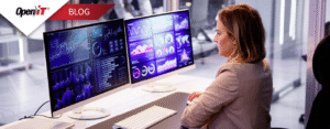 a professional woman monitors dual screens displaying software dashboards and analytics, representing FinOps strategies for IT cost optimization and software asset management in a modern office setting.
