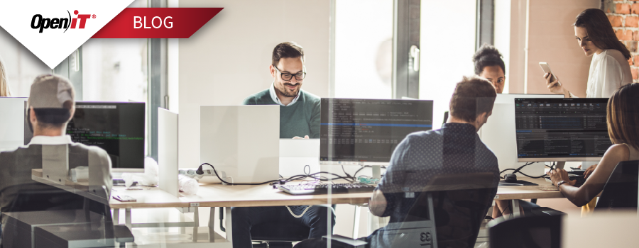 Open iT engineering team collaborating in an office workspace to enhance engineering visibility and close visibility gaps through software asset lifecycle management and compliance control.