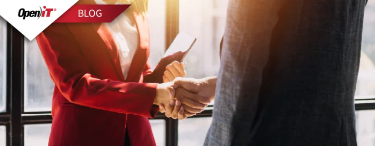 business professionals shaking hands in a bright office, representing open it’s software licensing solutions that strengthen partnerships, ensure compliance, and optimize software investments.